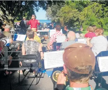  ??  ?? Katikati Concert Band playing Christmas music for the annual Tanners Point Christmas party.