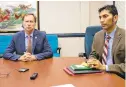  ?? RICK HUTZELL/CAPITAL GAZETTE ?? Anne Arundel County Executive Steuart Pittman, left, and County Health Officer Nilesh Kalyanaram­an talk about the coronaviru­s on Friday, after state officials confirmed three cases in Maryland.