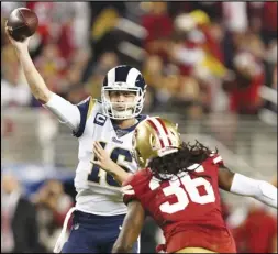  ?? Associated Press ?? CONFIDENT — Los Angeles Rams quarterbac­k Jared Goff (16) throws a pass as San Francisco 49ers defensive back Marcell Harris (36) applies pressure during the second half in Santa Clara on Saturday. Goff is hoping to end the season with a win against the Cardinals.