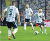  ??  ?? GETTY IMAGES Argentina’s Lionel Messi (R) during a 4-0 victory over Haiti at La Bombonera stadium in Buenos Aires, Argentina, on May 29, 2018