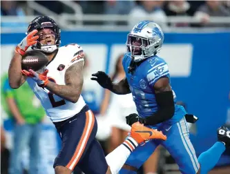  ?? AP ?? Bears receiver DJ Moore gets behind Lions cornerback Jerry Jacobs for a 39-yard touchdown pass.