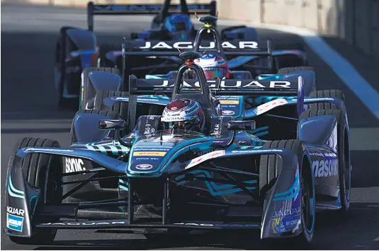  ?? Picture / Getty ?? Jaguar teammates Adam Carroll ( front) and Kiwi Mitch Evans are beginning to make up ground in the Formula E series. BASEBALL BASKETBALL CRICKET CYCLING FOOTBALL GOLF