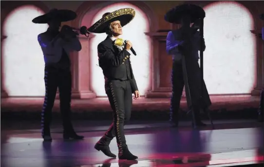  ?? (File Photo/AP/Chris Pizzello) ?? Alejandro Fernandez performs a medley Nov. 14, 2019, at the 20th Latin Grammy Awards at the MGM Grand Garden Arena in Las Vegas. The Mexican singer performed March 3 in Caracas, Venezuela.