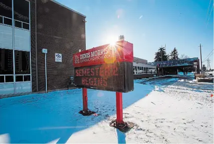  ?? JULIE JOCSAK TORSTAR ?? A sign in front of Denis Morris High School in St. Catharines announces Monday’s beginning of the second semester.