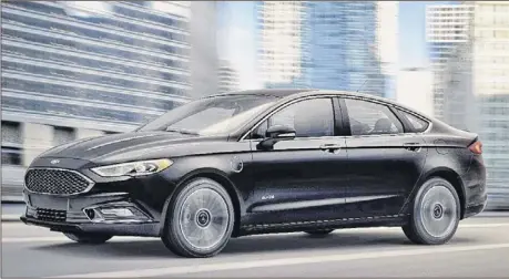  ??  ?? THE FORD FUSION ENERGI is a four-door mid-size available as a gas-powered, hybrid powered (HEV) or plug-in hybrid powered (PHEV) model. The 2019 model features a 20 percent larger battery pack for an increased range.