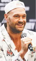  ?? MEG OLIPHANT / GETTY IMAGES ?? Tyson Fury, seen at a June 15 media event, has tested positive for COVID-19.