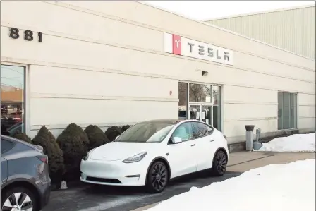  ?? Christian Abraham / Hearst Connecticu­t Media ?? The Tesla center on Boston Post Road in Milford. The state legislatur­e’s Transporta­tion Committee passed on Wednesday a bill allowing electric vehicle manufactur­ers to sell directly to consumers in Connecticu­t.