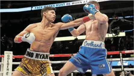  ?? /TIM WARNER / GETTY IMAGES ?? Ryan Garcia, left, throws a punch at Luke Campbell during their WBC Interim Lightweigh­t Title fight at American Airlines Center on January 2 in Dallas, Texas.