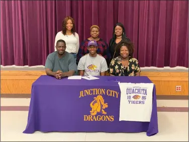  ?? Contribute­d Photo ?? Gibson signs with Ouachita Baptist: Junction City's Dhante Gibson is pictured with family members after signing with Ouachita Baptist on Wednesday. In the bottom row is Sammy Gibson (dad), Dhante Gibson and Shacazza Gray (sister). In the top row is Jameya Lovette (cousin), Sherlyn Lovette (aunt) and RhyKiya Gibson (sister).