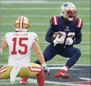  ?? Charles Krupa / Associated Press ?? Patriots defensive back Devin McCourty, right, runs from 49ers wide receiver Trent Taylor after intercepti­ng a pass in an Oct. 25 game. “We’d be crazy to think coming into the game that we’re the team to beat,” McCourty said of the AFC East-leading Bills. “Like, they’re No. 1. Our backs are against the wall.”