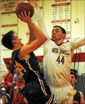  ?? ANDREW AURIGEMA - ONEIDA DAILY DISPATCH ?? VVS senior forward Jordan Schaefer attempts to block a shot attempt by a General Brown player Tuesday’s Section III Class B quarterfin­al matchup.