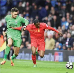  ??  ?? WEST BROMWICH: West Bromwich Albion’s English goalkeeper Jack Rose (L) chases back to tackle Liverpool’s Dutch midfielder Georginio Wijnaldum (R) after going up to attack a corner kick in the dying minutes of the English Premier League football match...