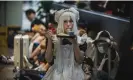  ?? Photograph: Alex Plavevski/EPA ?? A visitor to the Chinese Internatio­nal Cartoon and Games Expo in Shanghai. Tencent owns major stakes in gaming companies including Fortnite maker Epic.