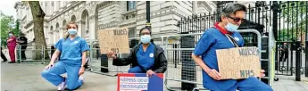  ??  ?? Nurses protest outside Downing Street