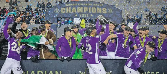  ?? ?? PACIFIC FC TEAMMATES CELEBRATE WITH THE NORTH STAR SHIELD AFTER DEFEATING FORGE FC BY A SCORE OF 1-0 DURING CANADIAN PREMIER LEAGUE CHAMPIONSH­IP GAME ACTION AT TIM HORTONS FIELD IN HAMILTON, ONT., SUNDAY, DEC. 5, 2021.