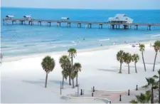  ?? PHOTO COURTESY CLEARWATER TOURISM BUREAU ?? MAKING WAVES: Florida’s Clearwater Beach, with its iconic pier, also ranks among the top spots.