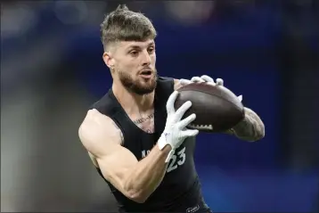  ?? MICHAEL CONROY — THE ASSOCIATED PRESS, FILE ?? Florida wide receiver Ricky Pearsall runs a drill at the NFL scouting combine on March 2in Indianapol­is. The 49ers on Thursday selected Pearsall in the first round.