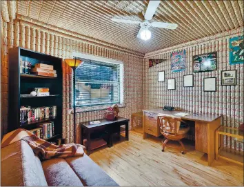  ?? COURTESY OF KEARNEY & ASSOCIATES REALTY ?? In tribute to his favorite beverage, a Budweiser lover lined the walls and ceiling of his West Palm Beach, Fla., condominiu­m with beer cans.