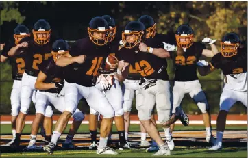  ?? KARL MONDON — STAFF PHOTOGRAPH­ER ?? Practicing in pads for the first time since the pandemic shut the season down last year, Adam Garwood (42) and his Los Gatos High School football teammates prepare to take the field on Feb. 26 in Los Gatos.