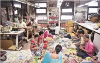  ??  ?? ( Clockwise from top) The Shop in Regal Building; Kabir and Aishwarya at The Shop in Noida; hand-dyed cloth; in the factory; block-printing