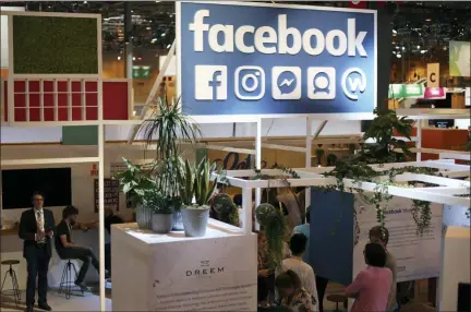  ?? THIBAULT CAMUS — THE ASSOCIATED PRESS FILE ?? The Facebook booth is seen at the Vivatech, a gadgets show in Paris, France. France has adopted a pioneering tax on internet giants like Google, Amazon and Facebook despite threats from the U.S.