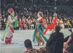  ??  ?? Pudjiastut­i, centre, at Indonesian Fashion Week in Jakarta in March.