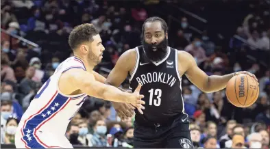  ?? Mitchell Leff / TNS ?? The Brooklyn Nets’ James Harden (13) dribbles the ball against the Philadelph­ia 76ers’ Georges Niang in October.