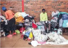  ?? AFP ?? Around 250 people, mostly Zimbabwean and Malawian nationals, are hosted at the Tsolo Community Hall in Johannesbu­rg’s Katlehong township after being displaced due to a new wave of anti-foreigner violence. —