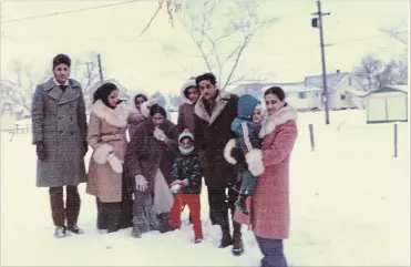  ??  ?? LLOYDMINST­ER, ALBERTALai­la Manek (far right in pink coat), with her children and extended family members, enjoying the snow shortly after settling in Canada.