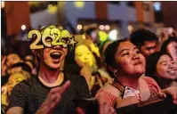  ??  ?? Revellers take part in New Year’s Eve celebratio­ns in Manila
