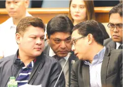  ??  ?? VICE-MAYOR Paolo Z. Duterte (L) and his brother-in-law Manases R. Carpio confer with their lawyer Rainier L. Madrid at the Senate hearing on illegal drugs on Thursday, Sept. 7.