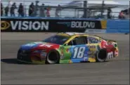  ?? AP PHOTO/ RICK SCUTERI ?? Kyle Busch (18) races on lap 210during a NASCAR Cup Series auto race on Sunday, Nov. 11, 2018, in Avondale, Ariz.