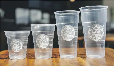  ?? STARBUCKS VIA AP ?? Starbucks shows off its new version of the company’s cold cup which is said to be made with up to 20% less plastic. The cups will be rolled out in stores this month.