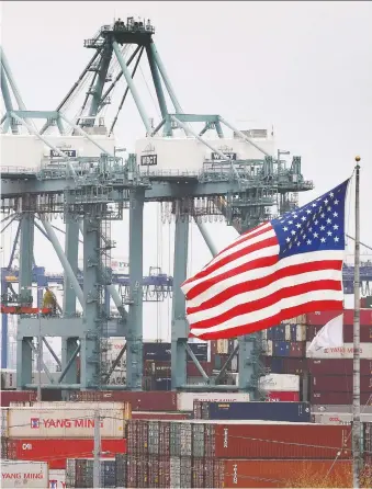  ?? MARK RALSTON/AFP/GETTY IMAGES FILES ?? Trade frictions proved damaging for the U.S. economy as business investment continued to flounder and the economy grew 2.3 per cent last year, the slowest pace since 2016.