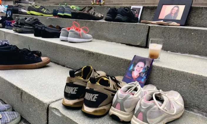  ?? Photograph: Chris McGreal/The Guardian ?? Shoes of those who died of an opioid overdose on the steps of the West Virginia capitol in Charleston.