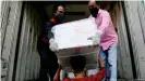  ??  ?? A shipment of the Oxford-AstraZenec­a vaccine arrives in Dhaka from India