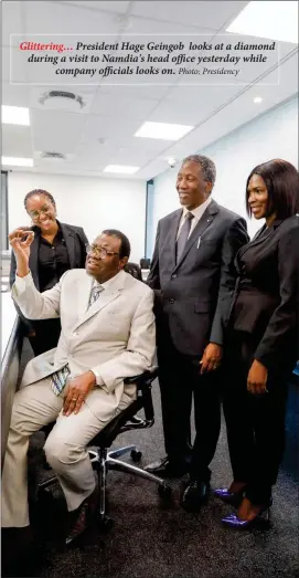  ?? Photo: Presidency ?? Glittering… President Hage Geingob looks at a diamond during a visit to Namdia's head office yesterday while company officials looks on.