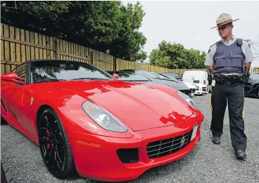  ?? LES BAZSO / POSTMEDIA NEWS FILES ?? Like it or not, high-performanc­e cars such as these impounded in Surrey, B.C., in 2011 for racing on the highway attract the attention of police, writes Lorraine Sommerfeld.