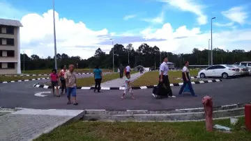  ??  ?? A whole family went to send off a student at the school yesterday, carrying all the various necessitie­s of boarding school life.