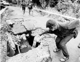  ??  ?? Phillip Henry said that residents of Llandewey, St Thomas, periodical­ly place irons under the bridge to support it when heavy vehicles are passing over. The bridge was further damaged last week and is inaccessib­le by vehicles.