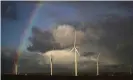  ?? Christophe­r Furlong/Getty Images ?? Wind turbines on Ince Salt Marshes near chemical and manufactur­ing plants on the River Mersey estuary. Chemists are working to use renewable energy to drive some industrial chemical processes. Photograph: