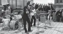  ?? Apple Corps Ltd. / Disney+ ?? The Beatles rooftop concert is captured in its entirety during Part 3 of “The Beatles: Get Back.”
