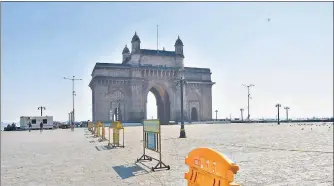  ?? BHUSHAN KOYANDE/ HT PHOTO ?? The Gateway of India wears a deserted look on Monday as new curbs to prevent crowding were introduced by the state to control the spread of the coronaviru­s pandemic.