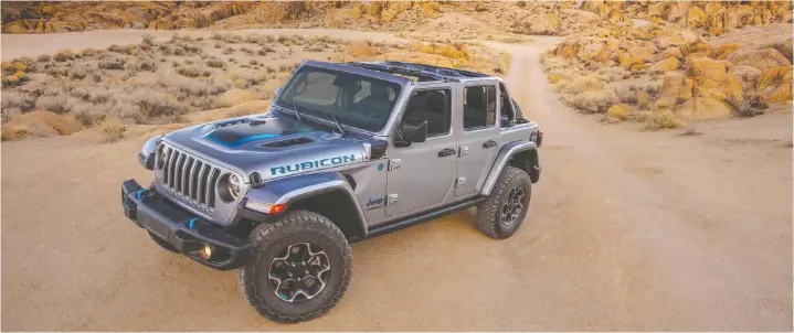  ?? — PHOTOS: JEEP ?? At $59,995, the 2021 Jeep Wrangler Rubicon has a turbocharg­ed 2.0-L four-cylinder with engine-mounted motor-generator unit and a 17-kWh battery pack.