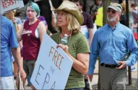  ?? MARIAN DENNIS — DIGITAL FIRST MEDIA ?? One activist holds a “Free the EPA” sign during the Pottstown Climate March on Saturday.