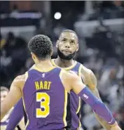  ?? Brandon Dill Associated Press ?? LeBRON JAMES is trying to win games while developing young Lakers teammates such as Josh Hart.