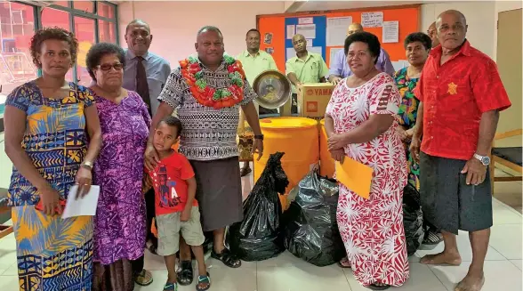  ?? ?? Minister of Rural and Maritime Developmen­t and Disaster Management Inia Seruiratu (middle) handed over assistance to Cikobia Women Virgin Coconut Oil Group in Labasa on May 4, 2022.