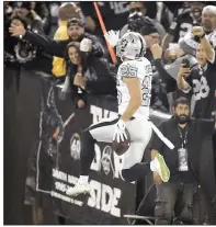  ?? AP/BEN MARGOT ?? Oakland free safety Erik Harris (25) celebrates after scoring on a 56-yard intercepti­on return for a touchdown during the Raiders’ 26-24 victory over the Los Angeles Chargers on Thursday in Oakland, Calif.