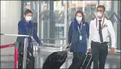  ?? SAMIR JANA/HT PHOTO ?? Air India crew members exit Netaji Subhas Chandra Bose Internatio­nal Airport at Kolkata on May 18.