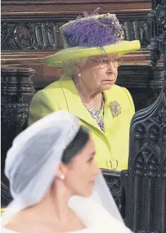  ?? REUTERS ?? Queen Elizabeth II looks on during the wedding of Prince Harry and Meghan Markle in St George’s Chapel at Windsor Castle on Saturday.